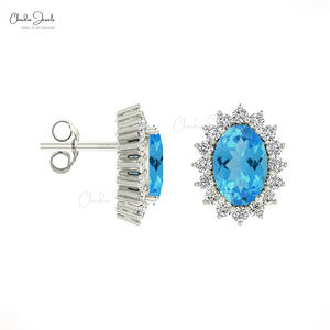 Fournisseur en gros de bijoux : Boucles d'oreilles clous en or 14K avec halo de diamants et topaze bleue suisse taille ovale 6x4mm, fermoir push-back, bijoux minimalistes pour femme - Product Image 4