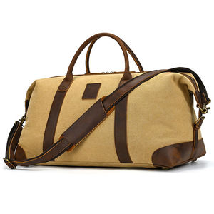 Canvas Heavy Duty Duffle Bag with Brown Leather Handles and Zipper Closure Customizable for Outdoor Travel and Weekend Use - Product Image 1