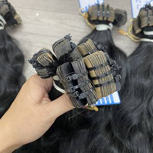 Precio al por mayor Natural Black Raw Wavy Bundle 100% Cinta vietnamita en extensiones de cabello Sin enredos Sin desprendimiento Super sedoso En stock - Product Image 6