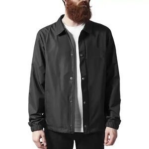 Veste Coach en nylon noir de qualité supérieure pour homme, fermeture à boutons pression, style minimaliste décontracté, streetwear urbain. - Product Image 1