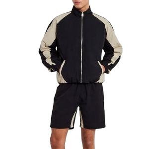 ชุดแจ็คเก็ตวินด์เบรกเกอร์และกางเกงขาสั้นผู้ชายแบบสองสี ชุดกีฬาน้ำหนักเบาสองชิ้น สำหรับวิ่ง ออกกำลังกาย สไตล์สตรีทแวร์ - Product Image 1