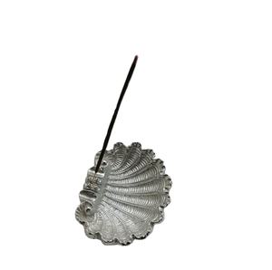 Compact shell inspired <b>incense</b> <b>holder</b> with textured surface designed to hold <b>incense</b> <b>stick</b> securely while collecting ash suits - Product Image 1