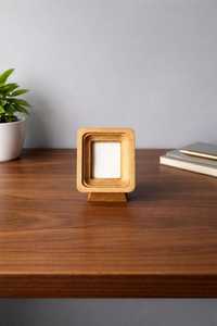 Handcrafted wooden gold <b>frame</b> on a stand made of natural wood - Product Image 1