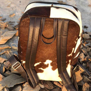Luxury handmade cowhide leather hair on school <b>backpacks</b> wholesale supplier OEM custom export student bags in affordable price - Product Image 3