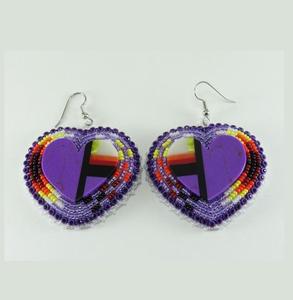 Pendientes de cuentas de cristal de lujo para ocasiones nupciales y festivas que ofrecen un acabado brillante y un estilo étnico. - Product Image 1