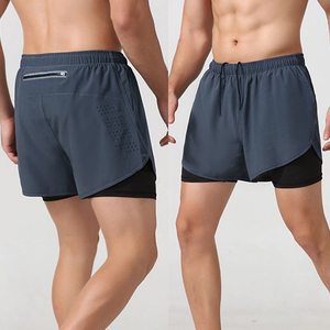 Shorts de compression pour homme, couleur unie, avec poches, séchage rapide, taille élastique, longueur mi-cuisse, en spandex et polyester, design tricoté - Product Image 1