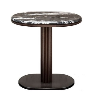 Table basse ronde moderne de luxe en marbre noir avec piétement en métal à colonne cannelée pour salon - Product Image 1