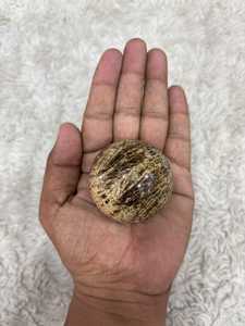 Banded aragonite <b>sphere</b> with layered mineral patterns earthy tones polished round form natural texture and distinctive - Product Image 4