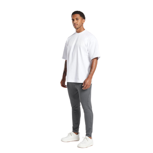 Pantalon homme sur mesure coupe slim, jambe fuselée, taille élastique, petit logo, style streetwear décontracté, fournisseur en gros d'articles de mode OEM - Product Image 1