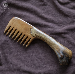 Rustic dark-stained <b>wooden</b> comb <b>carved</b> with complete moon phase cycle motifs along the handle, available at wholesale prices. - Product Image 3
