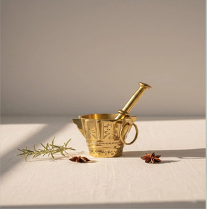 Engraved brass mortar and pestle with side ring handle accents, available at wholesale prices. - Product Image 1