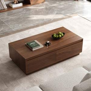 Table basse en teck massif à profil bas avec une surface large et une base linéaire robuste pour un salon décontracté - Product Image 1