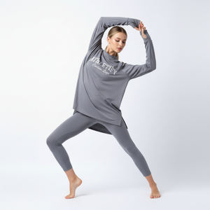 เสื้อทูนิคออกกำลังกายทรงหลวม แขนยาว สำหรับผู้หญิง ดีไซน์ชายเสื้อสูงต่ำ ระบายอากาศได้ดี น้ำหนักเบา เหมาะสำหรับยิม โยคะ วิ่ง และการฝึกซ้อม - Product Image 1