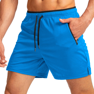 Shorts de sport bleus pour hommes à séchage rapide avec poches zippées, taille à cordon de serrage, longueur mi-cuisse, couleur unie, tissu tricoté - Product Image 5