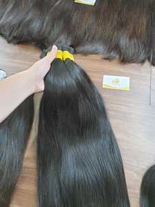 El vendedor de cabello Minh Khang en Vietnam ofrece extensiones de cabello humano a granel de color negro natural de 150kg en la lista de precios del almacén - Product Image 4