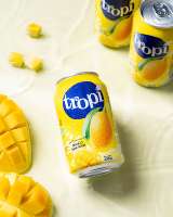 Boisson Tropi Juice 330ml en canette en aluminium 100% purée faible en gras saveur pastèque et fruits multiples jus frais pressé