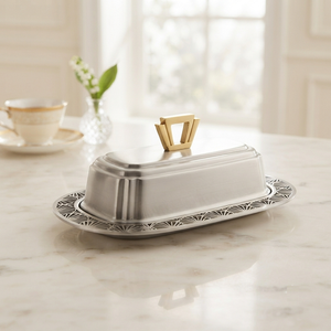 Plat à beurre ovale en acier inoxydable avec couvercle et poignée dorée, pour la conservation de la fraîcheur, idéal pour les fêtes et la cuisine moderne. - Product Image 1