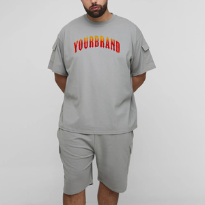 Conjunto de camiseta y pantalones cortos de algodón gris para hombre de la marca Your Brand, cuello redondo, estilo casual de verano, diseño con estampado de letras y bolsillo frontal, en venta en línea. - Product Image 1