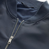 Blouson d'hiver à col montant en toile polyester/nylon, design tendance, imperméable, logo sur le devant, vente en gros pour hommes