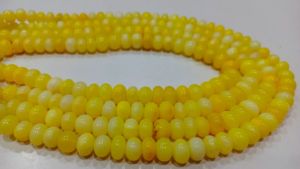 ลูกปัดโอปอลสีเหลืองทรงรอนเดลล์ เรียบเนียน ขนาด 7 ถึง 10 มม. ขายเป็นเส้น ยาว 8 นิ้ว ยี่ห้อ EMINENT JEWEL N ARTS ผลิตจากรัฐราชสถาน - Product Image 4