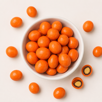 Dragées d'orange enrobées de chocolat et mangue séchée moelleuse, emballées dans une boîte personnalisée pour la vente en gros de chocolat