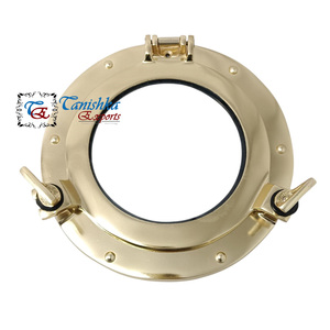 กระจกตกแต่งผนังทรงกลมขนาด 9 นิ้ว สีทอง ของ Tanishka Exports สำหรับตกแต่งบ้านสไตล์โจรสลัด ลายเรืออับปางสมัยใหม่ ทำจากอะลูมิเนียม เหมาะสำหรับงานแต่งงาน - Product Image 1