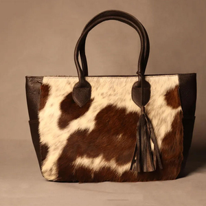 High quality cowhide leather hair on bags bulk supplier OEM custom branding premium <b>handbags</b> wholesale Handmade Cowhide Leather - Product Image 1