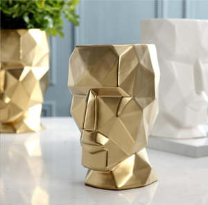 Elegant textured cream-white cylinders featuring striking dark metallic leaf patterns, available at wholesale prices. - Product Image 3