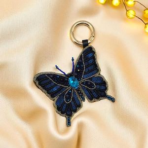 Llavero con Colgante de Mariposa Cola de Golondrina con Cuentas Azules Brillantes en Degradado - Product Image 3