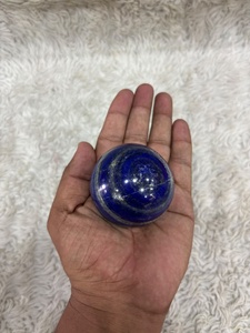 Sphère de lapis-lazuli présentant une coloration bleu roi profond, des reflets dorés de pyrite, une forme lisse et un minéral ornemental distinctif - Product Image 5