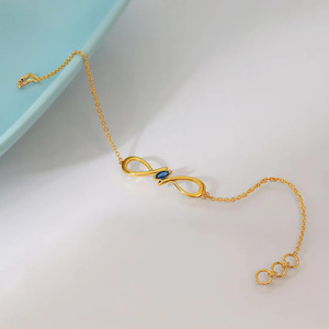 Midnight <b>Infinity</b> Diamond <b>Bracelet</b> with Yellow Gold Chain and Sleek Marquise Center Accent Design - Product Image 5