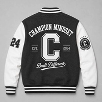 Veste varsity Champion pour homme, noire et blanche, avec patch brodé, coupe classique, style preppy, pour l'automne.