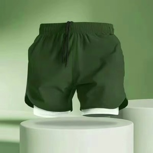 Shorts pour hommes noirs à séchage rapide, taille élastique, couleur unie, décontractés, sportifs, taille mi-haute, en tissu peigné, écologiques et respirants - Product Image 4