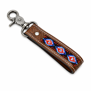 Llavero Artesanal de Cuero Marrón con Cuentas, Patrón Tribal Azul y Rojo, Acento Floral Grabado, Cierre Metálico, Estilo Boho Occidental - Product Image 1