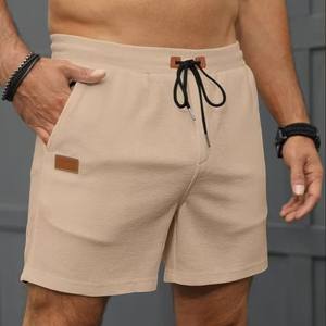 กางเกงขาสั้นสำหรับเล่นกีฬาผ้าวาฟเฟิลของผู้ชายฤดูร้อน2025แห้งเร็วกางเกงชายหาดสีทึบ - Product Image 1