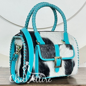 Bolso de lujo de cuero vacuno premium con asa trenzada y correa cruzada de cuero. - Product Image 1