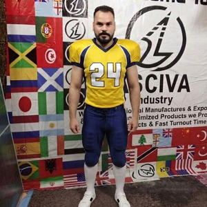 Uniforme de football américain avec design personnalisé pour l'équipe - Uniforme de football américain personnalisable - Design en maille jaune/bleue sublimé - Product Image 1