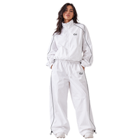 Coupe-vent utilitaire unisexe personnalisé en nylon imperméable avec empiècements en maille et passepoil contrastant, survêtement léger style streetwear, logo personnalisé