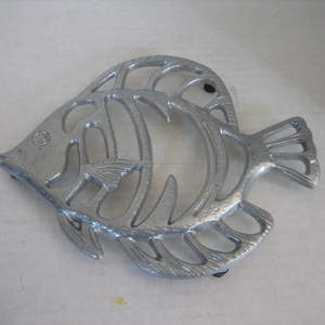 Modern Artistic Metal Sculpted <b>Trivet</b> With Cutout Design Perfect For Stylish Homes And Everyday Cooking Convenience - Product Image 1