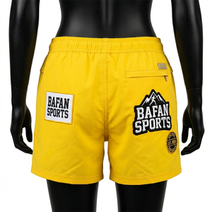 Shorts de baño premium de poliéster de secado rápido para mujer, color amarillo brillante, cintura con logo personalizado estampado por transferencia térmica. - Product Image 3