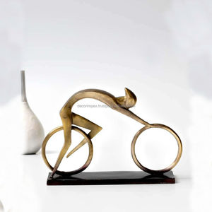 Home Center Fiesta Gold Solid Brass Cycling Figurita Instrucciones de cuidado Limpia con un paño húmedo Collection Fiesta - Product Image 1