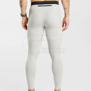 Pantalones de compresión ajustados para hombre, tela ligera y elástica, ideales para entrenamiento de alta intensidad, gimnasio y sesiones de running. - Product Image 3