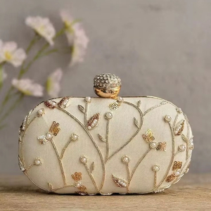 Elegant <b>ivory</b> minaudière with delicate gold floral embroidery. Available at wholesale prices. Timeless bridal style. - Product Image 1