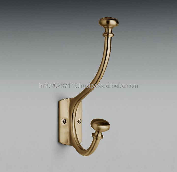 Authentic brass wall hooks with beautiful antique design perfect for practical hanging in charming interiors