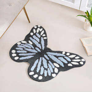 Alfombra Tufted con Diseño de Mariposa Negra y Patrón de Alas Azul Claro y Blancas para Decoración Moderna de Dormitorio - Product Image 1