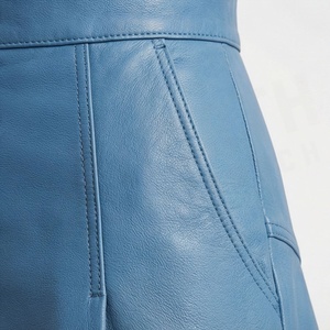 Minifalda de Cintura Alta en Cuero Sintético para Mujer, Estilo Asimétrico en Línea A, Plisada, de Color Sólido y Brillante, para Todas las Temporadas - Product Image 5