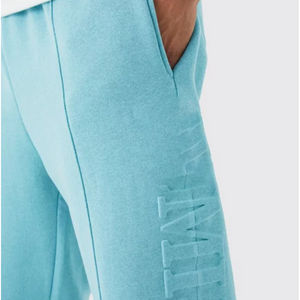 กางเกงจ็อกเกอร์ผู้ชายคุณภาพสูง 100% พร้อมโลโก้ 3 มิติแบบนูน กางเกงวอร์มทรงขาบานผ้าเฟรนช์เทอร์รี่แบบยืดหยุ่นสำหรับผู้ชาย - Product Image 2