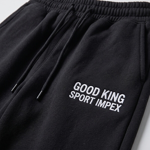 Pantalones de chándal oversize para hombre, negros, de pierna ancha, con bajo abierto, de forro polar, cintura elástica con cordón, bolsillos laterales, logo en la pierna, estilo baggy para jogging - Product Image 6