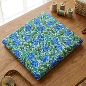 Vibrant Blue Floral Printed Cotton Fabric with Green Leaf Motifs for Dresses Sewing Quilting Crafts and Home Decor Projects Use - Product Image 4