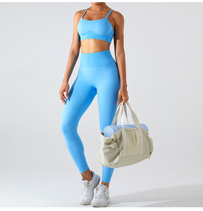 Conjunto Deportivo para Mujer con Sujetador Deportivo Cruzado en la Espalda y Leggings de Cintura Alta Acanalados, Ropa de Yoga y Fitness Azul, Sin Costuras, Transpirable y Elástica - Product Image 1